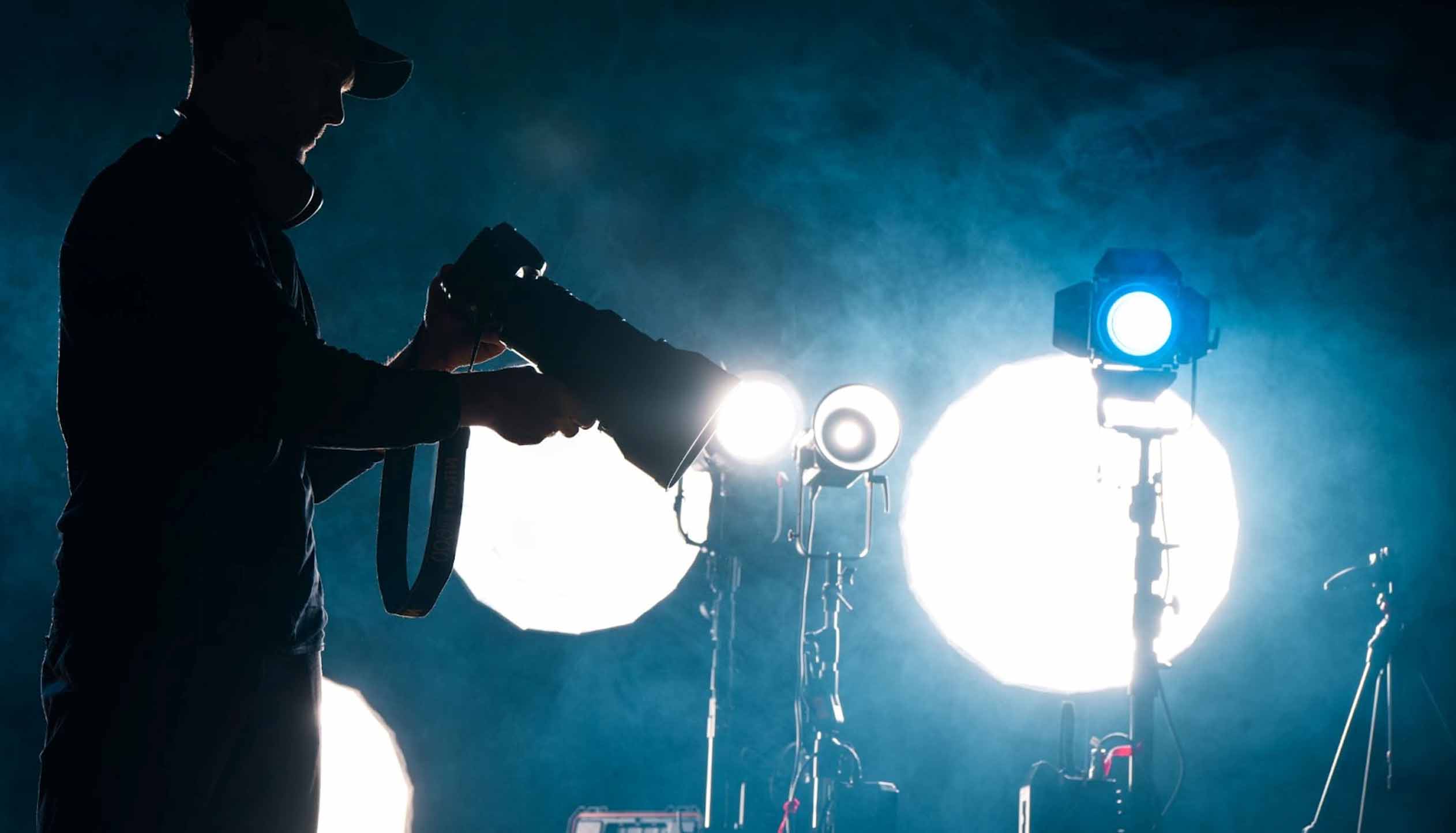 Photographer on a dark stage